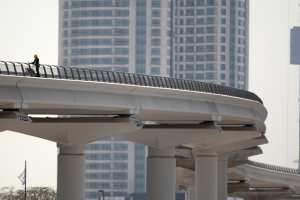 Workers put the final touches on the metro track in Dubai before its official opening in September. Galen Clarke / The National