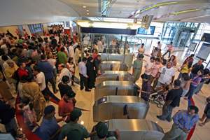 Crowds gather to ride the Dubai Metro at the Mall of the Emirates station in Dubai on September 11, 2009. Randi Sokoloff