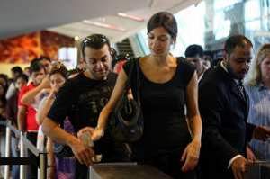 Passengers enter the metro station at the Mall of the Emirates. Nicole Hill / The National