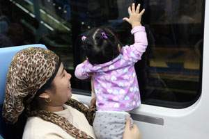 A young girl rides the Dubai Metro near the Deira City Centre in Dubai on September 12, 2009. Randi Sokoloff / The National