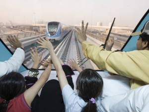 DUBAI METRO: Some of the first passengers wave to an oncoming train. (ITP Images)