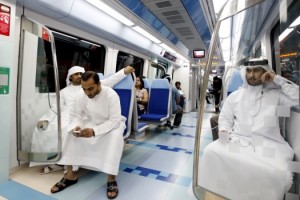 People take the first metro ride after the official opening of the Gulf Emirate's first metro network in Dubai, Sept. 9, 2009. (Mosab Omar/Reuters)