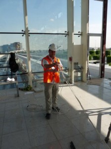 Trackside wireless base stations and WiMax radios are located at regular intervals along the route to create a corridor of wireless coverage through which the trains travel.  A Nomad Digital employee is pictured above installing equipment at one of the Metro stations.  Photo credit: Nomad Digital