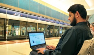 A Dubai Metro commuter accessing WiFi backhauled through WiMAX.