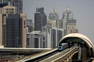 A metro train drives through Sheikh Zayed road in Dubai on September 10, 200, a day after the official opening of the Gulf emirate's metro network. Photograph: AFP