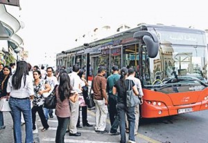     *  Residents queue for the bus in Satwa. RTA inspectors are keeping a close watch on drivers to ensure the safety of passengers.     * Image Credit: Gulf News Archive