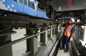 # A maintenance worker inspects a train at the Al Rashidiya depot. # Image Credit: Francois Nel/Gulf News