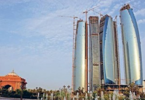     *  The Etihad Towers under construction in Abu Dhabi. Hani Al Hameli, Secretary General of the Dubai Economic Council, says there are encouraging signs of a turnaround.     * Image Credit: Alex Westcott/Gulf News