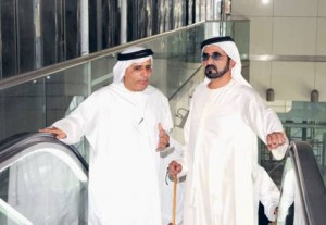     *  Shaikh Mohammad enters a station with Mattar Al Tayer.     * Image Credit: WAM