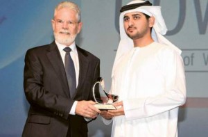 Shaikh Maktoum presents an award to Professor Robert J. Whelan, President of the University of Wollongong, yesterday in Dubai.