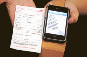     *  Image Credit: Abdel-Krim Kallouche/Gulf News     * A dejected motorist shows Gulf News his parking ticket and the SMS warning he received from the Dubai Roads and Transport Authority.