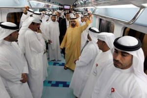   Sheikh Mohammed bin Rashid, Vice President of the UAE and Ruler of Dubai, rides on the inaugural journey of the Green Line, the rail system's second line after the Red Line opened exactly two years ago.  AFP PHOTO/KARIM SAHIB