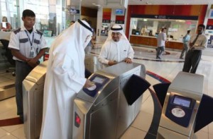     *  Image Credit: Francois Nel/Gulf News     * Commuters scan their tickets to enter the Dubai Metro's Health Care City Station on Saturday.