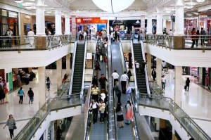   Shoppers such as these at Deira City Centre in Dubai view malls as a source of entertainment and socialising.  Amy Leang / The National