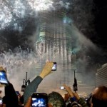 Spectators photograph the fireworks at the Burj Khalifa on New Year’s Eve in Dubai last year. Jeff Topping / The National