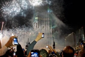 Spectators photograph the fireworks at the Burj Khalifa on New Year’s Eve in Dubai last year. Jeff Topping / The National 