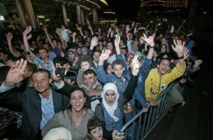     *  Image Credit: Hadrian Hernandez/Gulf News     * New Year revellers throng the area surrounding Burj Khalifa to catch a fireworks display ushering in 2012.