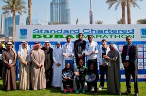 Winners with organizers and sponsors after the trophy presentation in the Standard Chartered Dubai Marathon. (AN photo)