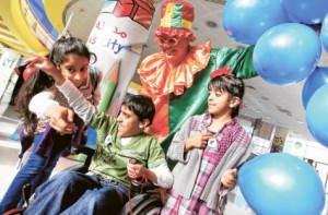     *  Image Credit: Asghar khan/Gulf News     * A child afflicted with a rare disease is entertained by friends and a clown at Saturday’s opening of the National Awareness Campaign on Rare Diseases at Children’s City, Creek Park in Dubai. The event, the second in two years, is organised by the Shaikh Hamdan Bin Rashid Al Maktoum Award for Medical Sciences.