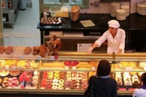 Cakes and pastries on display at the Paul Bakery & Restaurant in Dubai Mall. Traditionally, UAE retail stores have been staffed by Asian shop assistants but now more are coming from Europe.