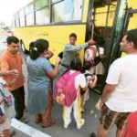 Image Credit: Gulf News archives     Pupils get on a school bus on Oud Metha Road. Al Dossary said there had been a ‘revolution’ in school transport since the RTA took it over in 2008.
