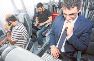      Image Credit: Abdel-Krim Kallouche/Gulf News     Passengers make use of the Wi-Fi facility in a bus operating between Dubai and Abu Dhabi.