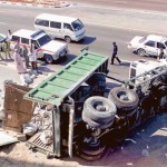      Image Credit: Gulf News archives     A truck loaded with boulders turns on its side in an accident on a construction site in Satwa.