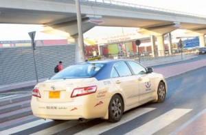      Image Credit: Virendra Saklani/Gulf News     A taxi passing through the slip road near Al Barsha toll gate. Some passengers are complaining that few taxies are being charged salik even on the slip road.