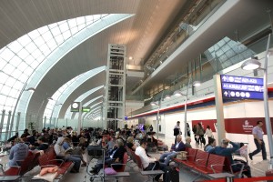 Passengers wait to board an Emirates Airbus A380 aircraft at the new Concourse A of Dubai airport in Dubai, United Arab Emirates, Sunday, Feb. 10, 2013. (AP Photo/Kamran Jebreili)