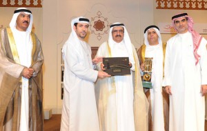 Shaikh Hamdan bin Rashid presenting the award to one of the winners as, Hussain Nasser Lootah and other officials look on during the ceremony in Dubai on Wednesday. — Supplied photo