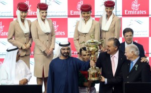 Sheikh Mohammed presents the Dubai World Cup trophy to Animal Kingdom, ridden by Joel Rosario and owned Arrowfield Stud & Team Valor, from the USA. (Patrick Castillo)