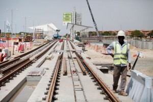 Workers lay tracks and build a station near Dubai Media City for the project. The trams are being manufactured in France. Sarah Dea / The National 