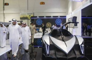 Image Credit: Supplied RACING AHEAD. Shaikh Maktoum Bin Mohammad Bin Rashid Al Maktoum, Deputy Ruler of Dubai, previews a prototype of the Devel Sixteen at the Dubai International Motor Show last month.