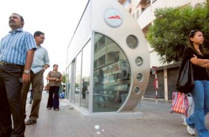      Image Credit: Abdel Krim Kallouche/Gulf News Archives     People in Al Karama wait outside a bus stop as the air conditioner inside is not working.