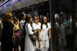      Image Credit: XPRESS/Zarina Fernandes     Let's Metro: Metro faithfuls wait for the train to arrive