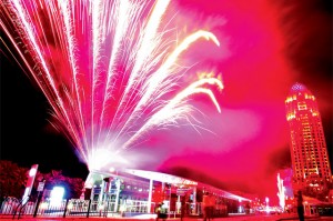 Fireworks light up the sky as the first tram passes by the Media City Station during its opening on Tuesday night. — KT photo by Dhes Handumon