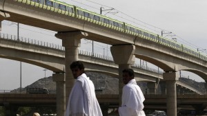 A MakkahMetro train passes over Muslim pilgrims' heads towards Mina ahead of the hajj main ritual at Mount Arafat outside Makkah. (File photo: AP)