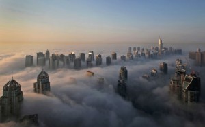 In this Monday, Oct. 5, 2015 file photo, a thick blanket of early morning fog partially shrouds the skyscrapers of the Marina and Jumeirah Lake Towers districts of Dubai, United Arab Emirates. Dubai’s rapid transformation from a desert outpost into one of the world’s most architecturally stunning cities is mapped out in the Marina. Where just 15 years ago there was empty, flat land, today a bustling neighborhood thrives centered around a canal and an impressive skyline that pierces through the clouds. (AP)