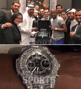 Mayweather with staff from the Hublot store (above) and the $1.1m watch (below).